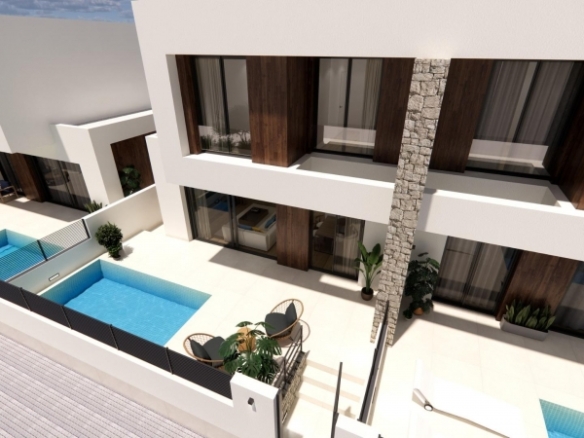 Urbanización moderna en Dolores de 8 chalets semi-adosados.